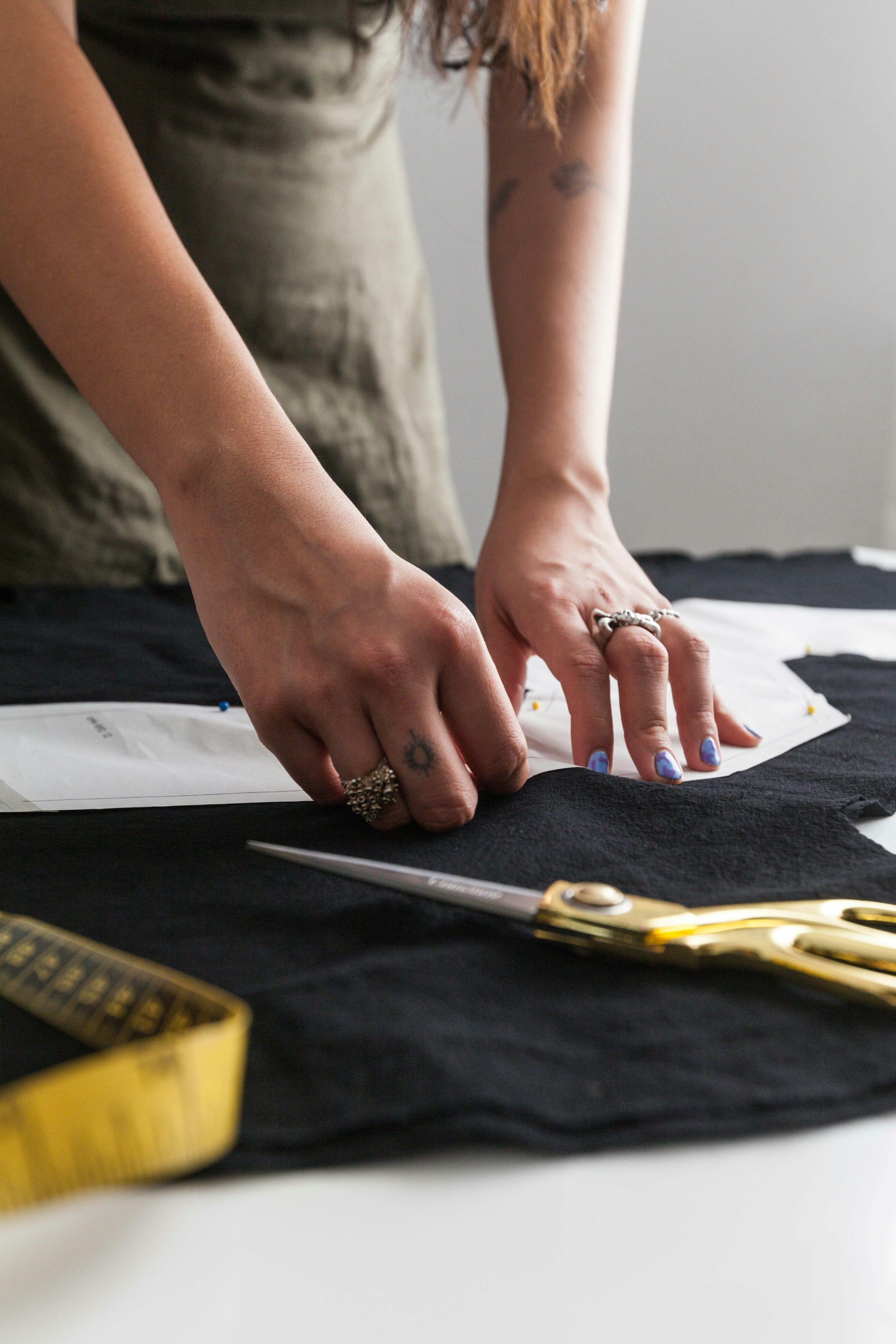 Female tailor working on garment