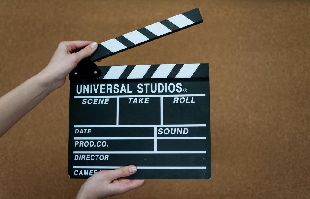 a person using a clapperboard