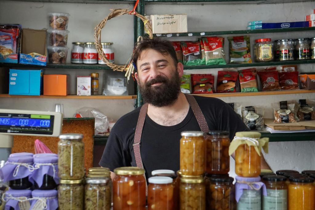 retail shop owner surrounded by jars and merchandise