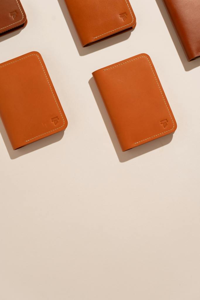 sleek brown leather wallets on a clean white background