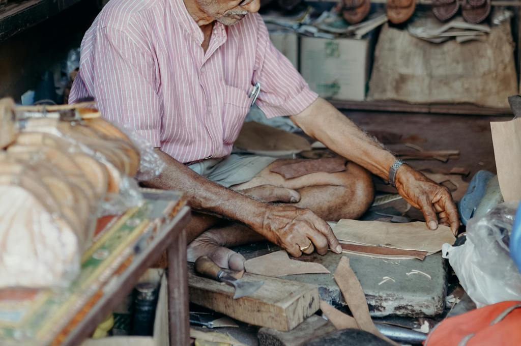 Leather trader sitting on the ground working on leather